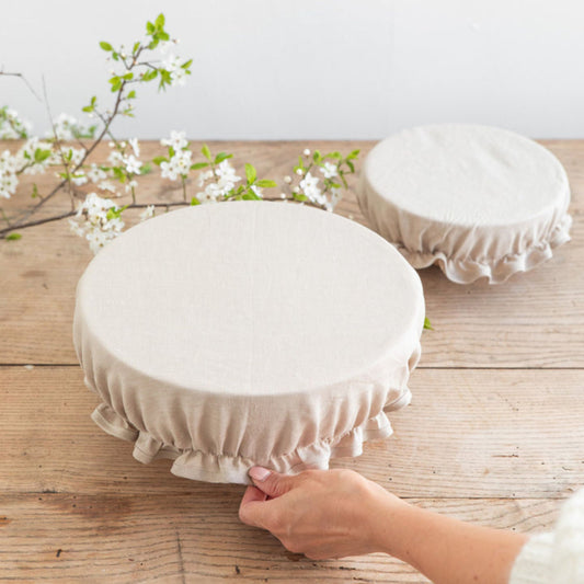 Sett med to miljøvennlige bolletrekk i 100 % naturlig lin, ideelle for å dekke boller og bevare ferskhet uten plastbruk.