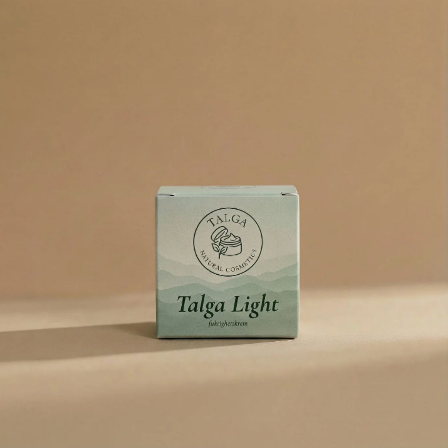 Talga Light fuktighetskrem i lysegrønn produkteske med Talga Natural Cosmetics-logo, på nøytral bakgrunn.